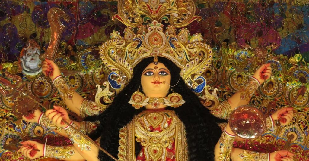 Vibrant depiction of Hindu goddess Durga adorned with intricate details, symbolizing strength and divinity.